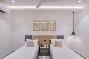 Postel nebo postele na pokoji v ubytování SKYLA Studios & Suites - Kondapur