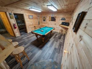 an overhead view of a pool table in a cabin at Kori's Mountain View, FREE tickets each paid day, Theater Room, Hot Tub, Game Room, WIFI!!! in Townsend
