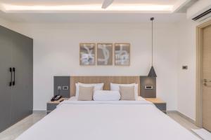 Postel nebo postele na pokoji v ubytování SKYLA Studios & Suites - Kondapur