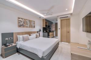 Postel nebo postele na pokoji v ubytování SKYLA Studios & Suites - Kondapur