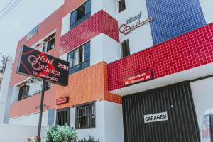 a building with a sign in front of it at Hotel Aliança in Salvador