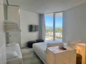 Postel nebo postele na pokoji v ubytování Hotel Aromar