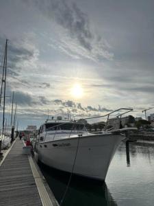 a boat is docked at a dock in the water at Seadream Classic Yacht in Figueira da Foz