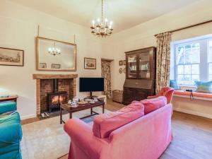a living room with two couches and a fireplace at 2 bed property in Kelso 86452 in Birgham