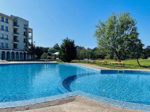 a large swimming pool in front of a building at Boutique House Blue Lagoon by Flat Mаnаger in Balchik