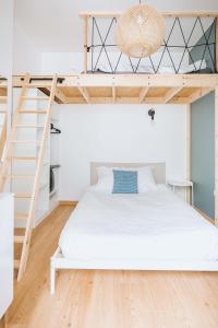 Postel nebo postele na pokoji v ubytování F2 un dimanche à Vichy Villa Marie Celine