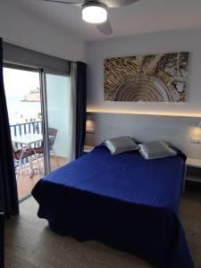 Posteľ alebo postele v izbe v ubytovaní Hotel Rio Mar