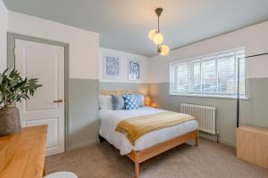 a bedroom with a bed and a window at Bella Vista in Whitby