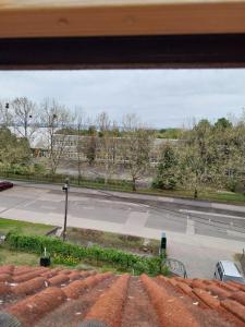 a view of a street from a window at Squash Apartments & Studios in Siófok