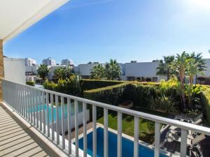a balcony with a view of a swimming pool at Luxury House - Privat Heated Pool & Ecologic & BBQ & Privacy & Albufeira in Albufeira