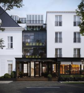 a rendering of the front of a white building at Park Lane Copenhagen in Hellerup