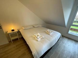 Postel nebo postele na pokoji v ubytování Freesia, Maison neuve avec jardin et garage