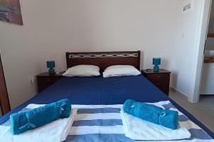 Postel nebo postele na pokoji v ubytování Ένα παράθυρο στο Αιγαίο.