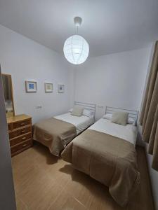 Katil atau katil-katil dalam bilik di Apartamento El Ingenio