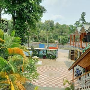 a view of a garden from a house at Aranya Darshan in Lataguri