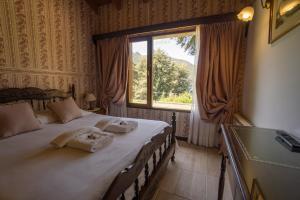 Cama ou camas em um quarto em Hosteria El Condado
