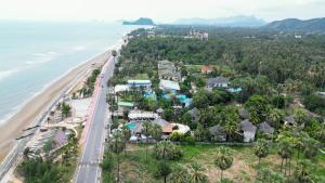 an aerial view of a beach with houses at Tanaosri Resort Pranburi in Pran Buri
