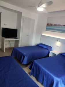 Posteľ alebo postele v izbe v ubytovaní Hotel Rio Mar