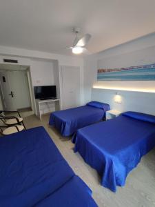 Posteľ alebo postele v izbe v ubytovaní Hotel Rio Mar