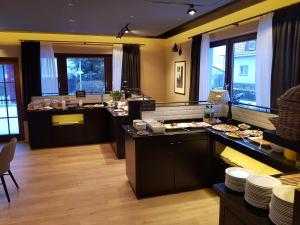 a kitchen with a counter with food on it at Hotel Stümpelstal in Marburg an der Lahn