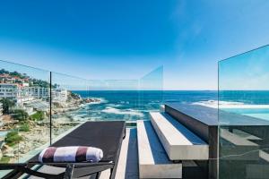 a balcony with a view of the ocean at The Aurum Collection by Totalstay in Cape Town