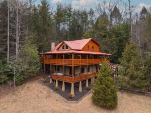 a large wooden house in the middle of a forest at A Family Affair in Blue Ridge