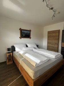 Postel nebo postele na pokoji v ubytování Apartment Alpenstyle Ennstal