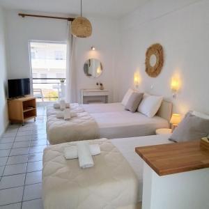 Ένα ή περισσότερα κρεβάτια σε δωμάτιο στο Villa Thalassa Apartments
