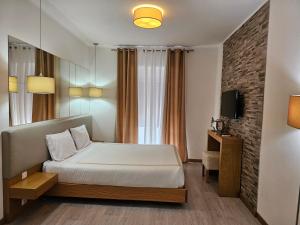 Ένα ή περισσότερα κρεβάτια σε δωμάτιο στο Vistadouro 2