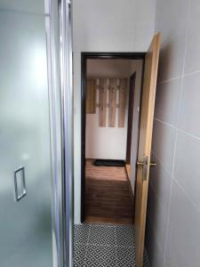 an open door to a room with a hallway at Penzion Betty in Okounov