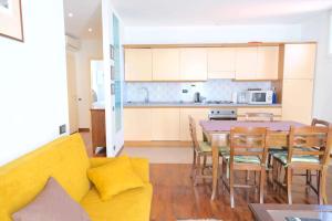 a kitchen and dining room with a table and chairs at Case VR Holiday - Residenza Leo in Verona