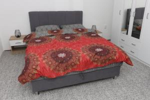 Ένα ή περισσότερα κρεβάτια σε δωμάτιο στο Apartman Dunja