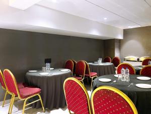 a conference room with tables and chairs and tablesktop at Treebo Trend Taj Dream Agra in Agra