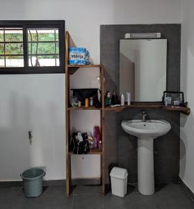 a bathroom with a sink and a mirror at Casa Lamar in Sanyang