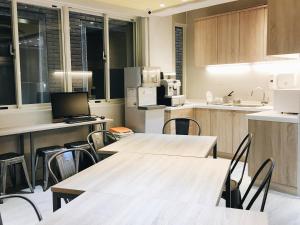 Eldhús eða eldhúskrókur á 日初青旅 Sundaily Hostel 北車