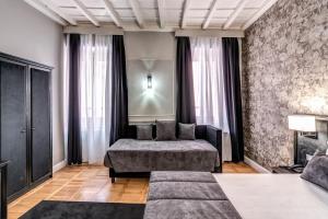 Postel nebo postele na pokoji v ubytování Relais Fontana Di Trevi Hotel