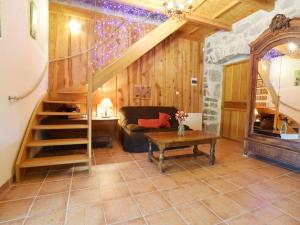 a living room with a staircase and a couch at Vintage Holiday Home in Lanas with Swimming Pool in Lanas