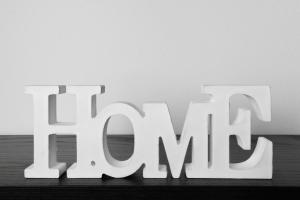 a white sign for the wordax sitting on a table at Piombino Apartments - Casa XX Settembre in Piombino