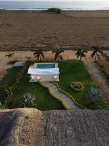 an aerial view of a house on the beach at Casa Carey Villa en la Playa in Tlachicón