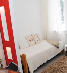 מיטה או מיטות בחדר ב-Pantea Messe Apartments