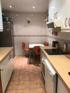 a kitchen with a table and chairs in it at buen lugar trabajo y familiar in Ciudad Real