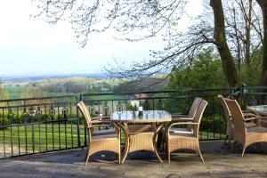 a table and chairs on a balcony with a view at Dreams Beckum in Beckum