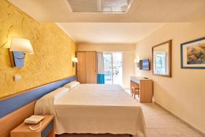 a hotel room with a bed and a desk at AHOI! Urban Beach in Palma de Mallorca