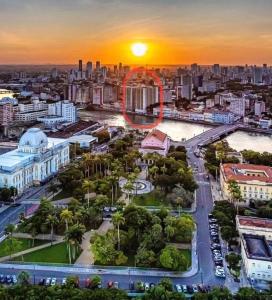 an aerial view of a city at sunset at Flat mobiliado na rua da Aurora in Recife