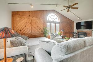 a living room with a couch and a tv at Pet-Friendly Ohio Escape with Pool, Deck and Fire Pit! in Mount Vernon