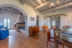 a kitchen and living room with a table and chairs at Il Querceto by Great Stays in Città della Pieve