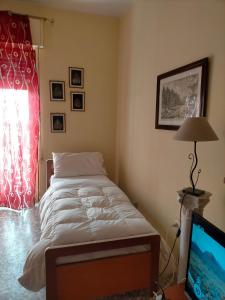 Giường trong phòng chung tại Sleep In Sicily
