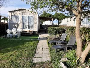 Zahrada ubytování SERENITY 565 au Lac Des Rêves-camping 4 étoiles-mobil home 3ch-6pl-clim-sdb- wc séparé-au calme, belle vue sur le lac, sans vis à vis