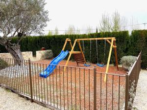 a playground with a slide and a swing set at LE DOMAINE 5 étoiles Spa Saint Quenin Vaison 30 personnes MONT VENTOUX PROVENCE in Vaison-la-Romaine