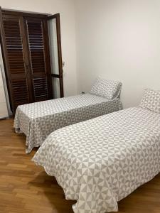 Ein Bett oder Betten in einem Zimmer der Unterkunft Baaria house
